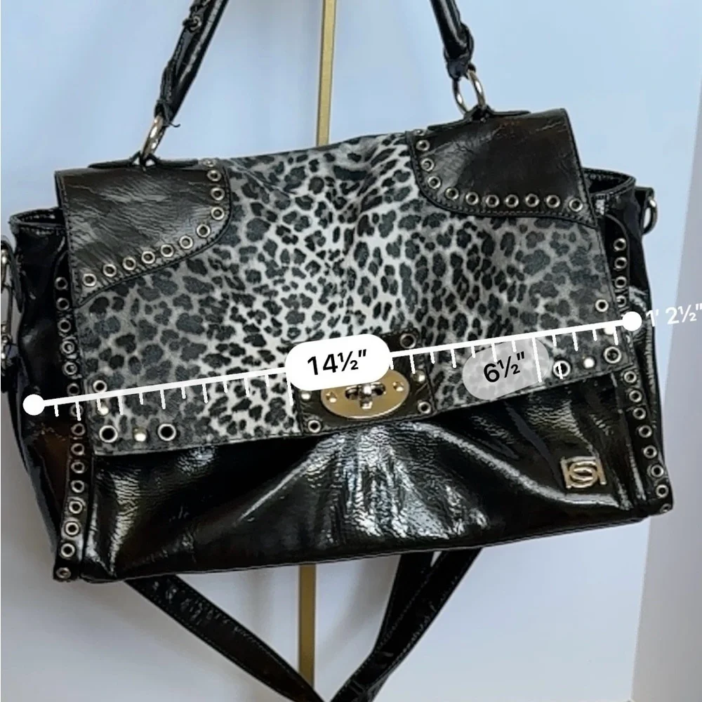 BEBE Large Handbag Leopard Grommet in Black and gray and gold